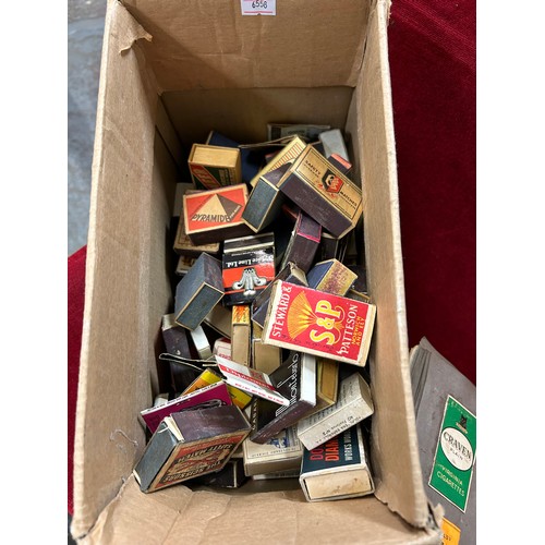 157 - COLLECTION OF VINTAGE CIGARETTE PACKETS IN AN ALBUM AND A BOX OF VINTAGE MATCHBOXES - OVER 100 IN TO... 