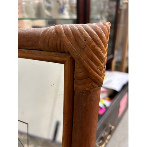 113 - DECORATIVE MIRROR IN BAMBOO TYPE FRAME WITH ELEPHANT AND CALF DESIGN