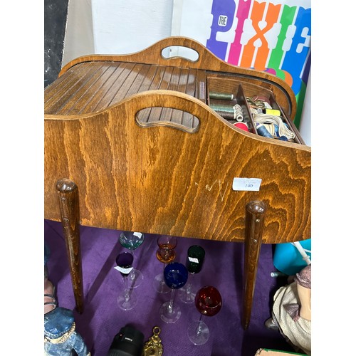 140 - A MID CENTURY TAMBOUR TOPPED SEWING BOX ON TAPERED LEGS WITH SEWING CONTENTS