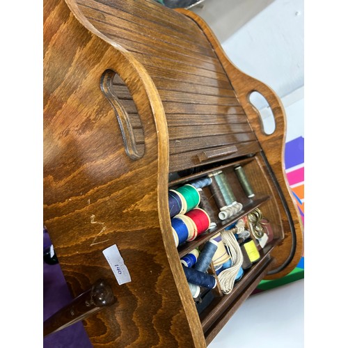 140 - A MID CENTURY TAMBOUR TOPPED SEWING BOX ON TAPERED LEGS WITH SEWING CONTENTS