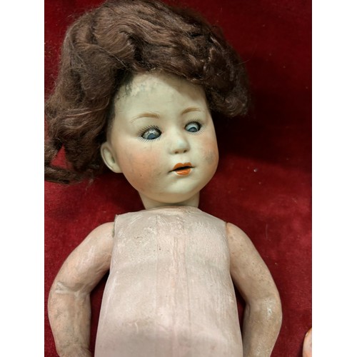 177 - An antique German bisque headed doll with composition body AF. The head with glass eyes, makers mark... 