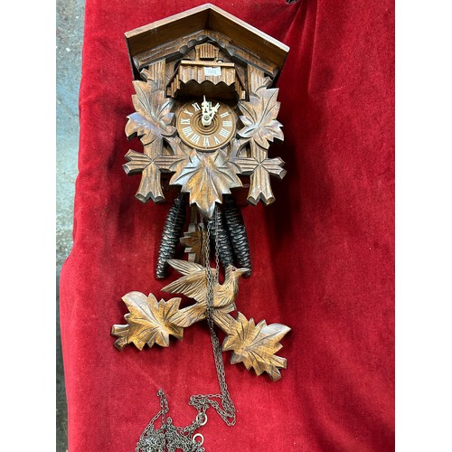 143 - A VINTAGE BLACK FOREST WOODEN CUCKOO CLOCK WITH PINE CONE WEIGHTS & PENDULUM