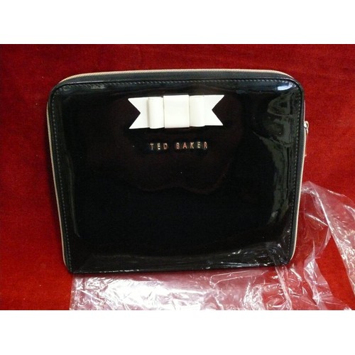 383 - TED BAKER TABLET CASE IN BLACK PATENT WITH CREAM BOW.