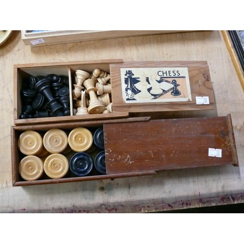 384 - VINTAGE DRAUGHTS AND CHESS PIECES IN WOODEN 'SLIDE-LID' BOXES.