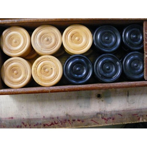 384 - VINTAGE DRAUGHTS AND CHESS PIECES IN WOODEN 'SLIDE-LID' BOXES.