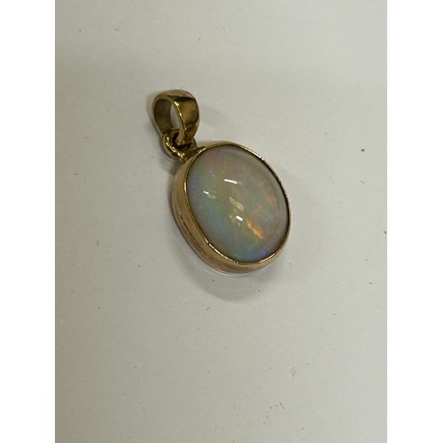 14 - FIRE OPAL .57 CRT 10 X 5 MM set in 9CT GOLD PENDANT PLENTY OF COLOURS LOTS OF FIRE RED, GREEN, BLUE ... 