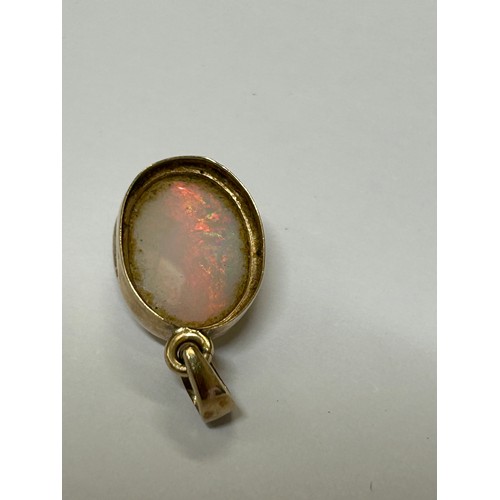 14 - FIRE OPAL .57 CRT 10 X 5 MM set in 9CT GOLD PENDANT PLENTY OF COLOURS LOTS OF FIRE RED, GREEN, BLUE ... 