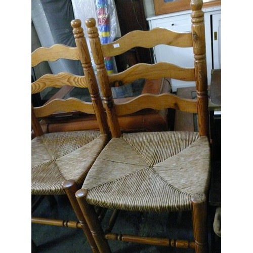 433 - 4 X PINE KITCHEN CHAIRS WITH RUSH SEATS, LADDER BACKS.