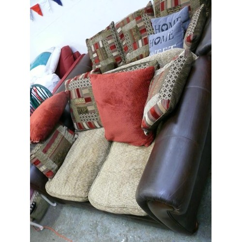 455 - 3 SEATER AND 2 SEATER BROWN LEATHER SOFAS WITH LARGE PATCHWORK CUSHIONS IN DEEP REDS/BROWN/SAND.