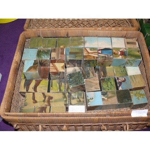 106 - A VINTAGE CUBE JIGSAW IN A WICKER BASKET