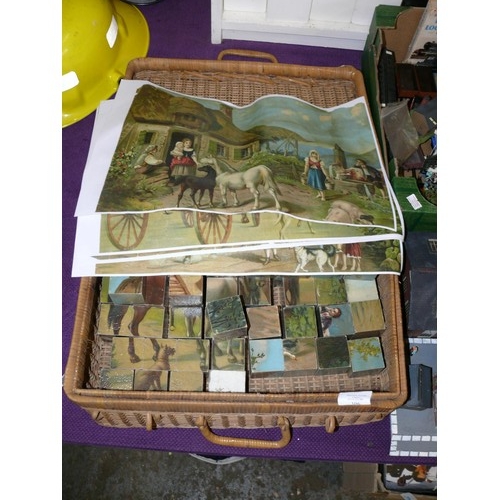 106 - A VINTAGE CUBE JIGSAW IN A WICKER BASKET