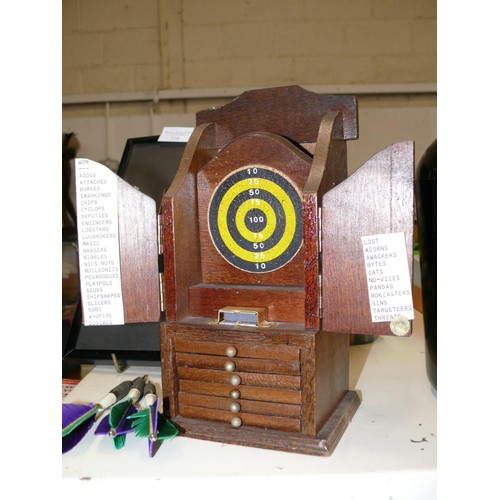 210 - FRAMED AND GLAZED HOLOGRAPHIC PICTURE OF A DARTBOARD PLUS A VINTAGE WOODEN COASTER AND MATCH STRIKER... 