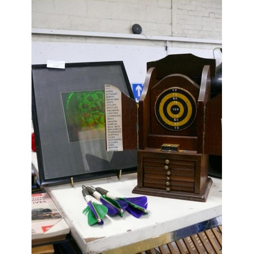 210 - FRAMED AND GLAZED HOLOGRAPHIC PICTURE OF A DARTBOARD PLUS A VINTAGE WOODEN COASTER AND MATCH STRIKER... 