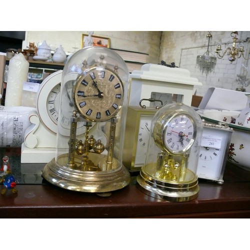 261 - A METAL CASED CARRIAGE CLOCK PLUS ONE OTHER AND A DOME MANTLE CLOCK