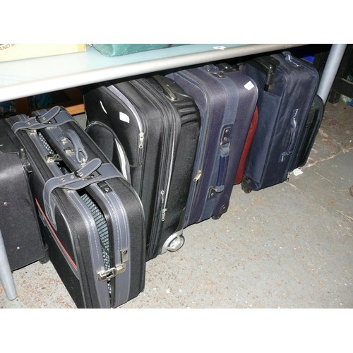 325 - 7 VARIOUS SUITCASES