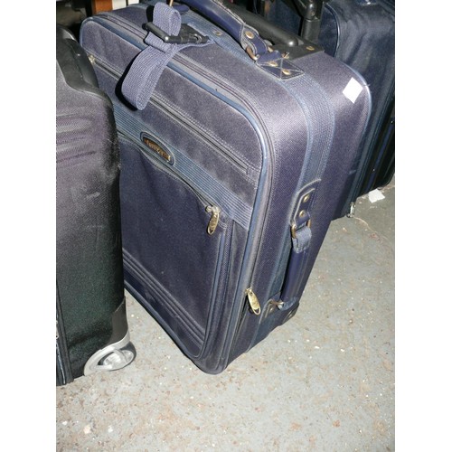 325 - 7 VARIOUS SUITCASES