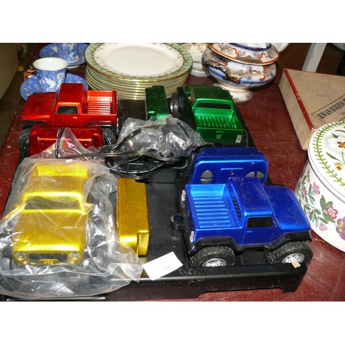 330 - SET OF 4 DIFFERENT COLOUR REMOTE CONTROL TRUCKS ON DISPLAY STAND