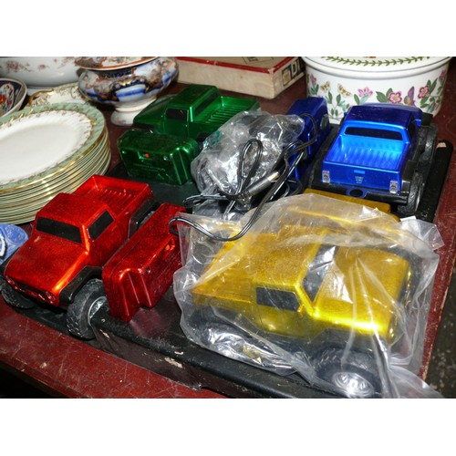 330 - SET OF 4 DIFFERENT COLOUR REMOTE CONTROL TRUCKS ON DISPLAY STAND