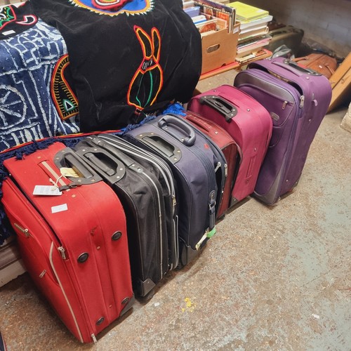 45 - COLLECTION OF 6 SUITCASES WITH WHEELS