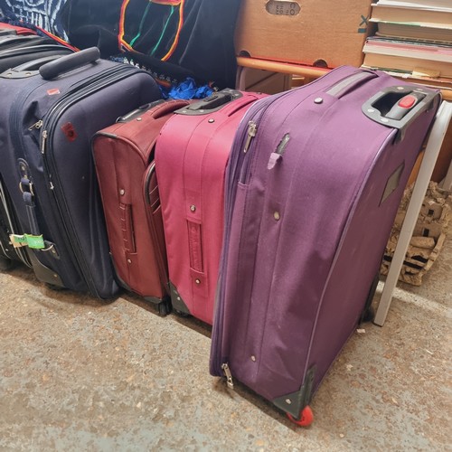 45 - COLLECTION OF 6 SUITCASES WITH WHEELS