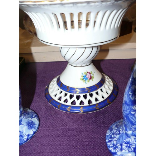 67 - A LOVELY BLUE AND WHITE HAND PAINTED PIERCED FRUIT BOWL INCLUDING 2 BLUE CANDLE STICKS