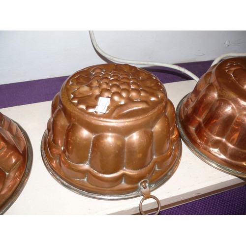 72 - 3 VINTAGE COPPER JELLY CULINARY MOULDS, FEATURING  A GEOMETRIC DESIGN , FRUIT AND A CHICKEN.