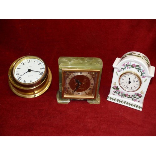 74 - THREE CLOCKS 1 BRASS BULKHEAD STYLE ONE PORCELAIN AND A NICE WINDUP CLOCK IN ONYX AND BRASS  BY ELLO... 