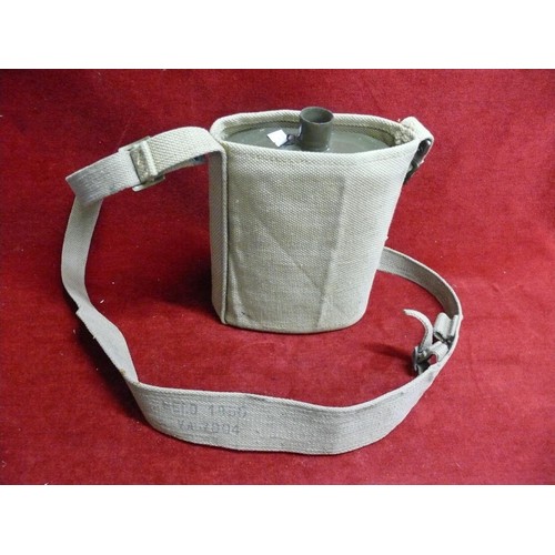 75 - A MILITARY WATER CANTEEN IN A KHAKI SHOULDER CARRY CASE