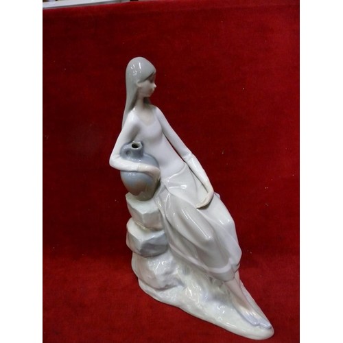 56 - VINTAGE LLADRO NAO 02010229 GIRL WITH WATER JUG SITTING ON ROCKS THIS IS A RETIRED PIECE