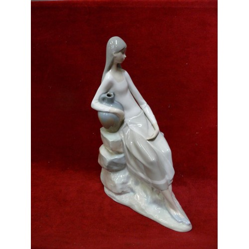 56 - VINTAGE LLADRO NAO 02010229 GIRL WITH WATER JUG SITTING ON ROCKS THIS IS A RETIRED PIECE