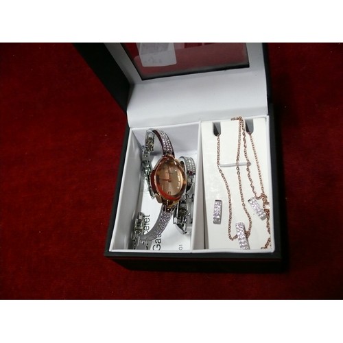 17 - A SEKONDA WATCH SET THE WATCH, NECKLACE, BRACELET & EARRINGS