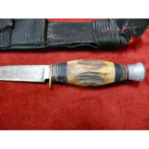 7 - A VINTAGE SHEATH KNIFE WITH ANTLER HILT AND SCABBARD SHARPENING STONE