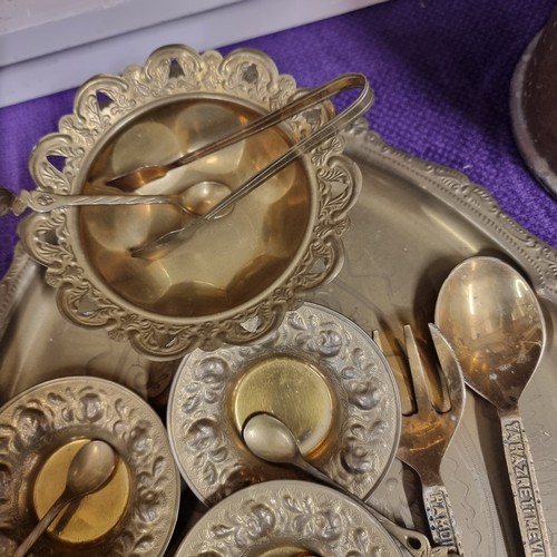 79 - ORNATE BRASS TRAY WITH BOWL AND NIPS SMALLBOWLS WITH SPOONS, 2 SERVERS AND A BRASS ASHTRAY