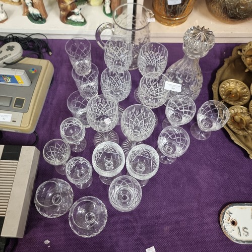 80 - CRYSTAL, A LOVELY SET OF CRYSTAL GLASSES INCLUDING, TUMBLERS, WINE GLASSES, BRANDY GASSES, A LARGE J... 