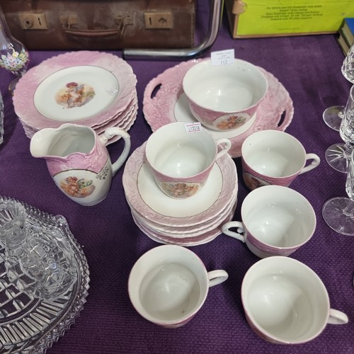 112 - A CHEEKY CHERUB CHINA PART TEA SET COMPRISING OF A PLATTER, JUG AND BOWL, 6 TEA PLATES, 6 SAUCERS AN... 