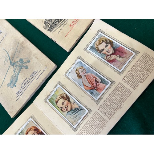 12 - THREE CIGARETTE CARD ALBUMS TO INCLUDE AN ALBUM OF FILM STARS BY JOHN PLAYER (COMPLETE) AN ALBUM OF ... 