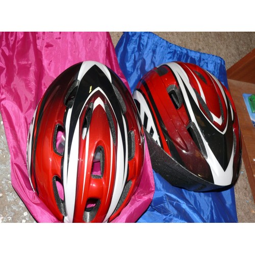 133 - CYCLING ACCESSORIES INCLUDING 2 HELMETS WITH PROTECTIVE CARRY BAGS, 2 BIKE LOCKS 2 SETS OF BIKE SPAN... 