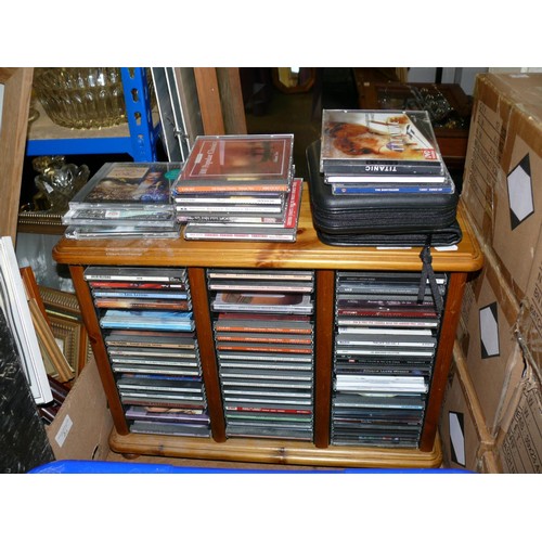 582 - LARGE SELECTION OF CD'S IN A COMPACT PINE STORAGE CASE