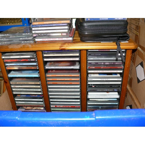 582 - LARGE SELECTION OF CD'S IN A COMPACT PINE STORAGE CASE