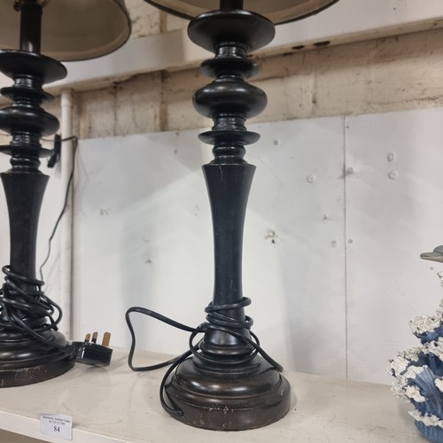 84 - MATCHING PAIR OF EBONISED TURNED TABLE LAMPS,  WITH GREY SHADES TRIMMED WITH CREAM LACE, BOTH IN VER... 