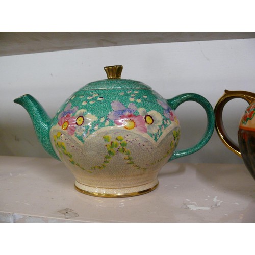 81 - 2 X HAND PAINTED TEAPOTS 1930'S, ONE IN TURQUOISE AND PINK, MADE IN ENGLAND AND SIGNED AND THE OTHER... 