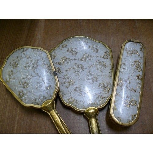 109 - RETRO BRUSHES AND MIRROR SET, NICE EXAMPLE WITH LACE INSERT TO THE MIRROR AN FINISHED IN GILT