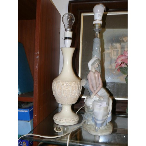 130 - 2 TALL LAMP BASES - ONE IN THE STYLE OF LLADRO THE OTHER CURVED CREAM