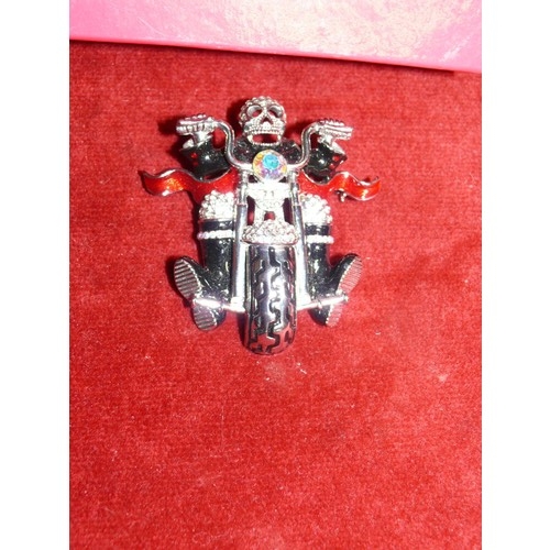 11 - BUTLER AND WILSON SKELETON BIKER BROOCH, BLACK AND RED ENAMEL DETAIL ADORNED IN CRYSTALS