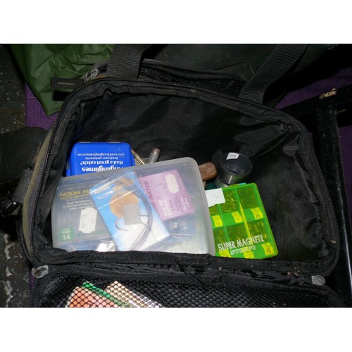 148 - FISHING ACCESSORIES CONTAINED IN A GREEN SMALL CARRY CASE WITH MULTI POCKETS, TOOLS HOOKS LINE AND M... 