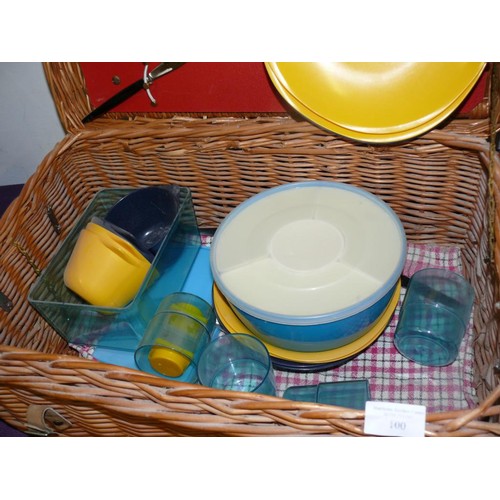 100 - LARGE WICKER PICNIC BASKET WITH CONTENTS OF PLASTIC PLATES, CUPS, CUTLERY ETC