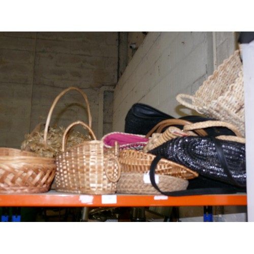 469 - A WHOLE SHELF OF WICKER BASKETS AND VARIOUS BAGS.