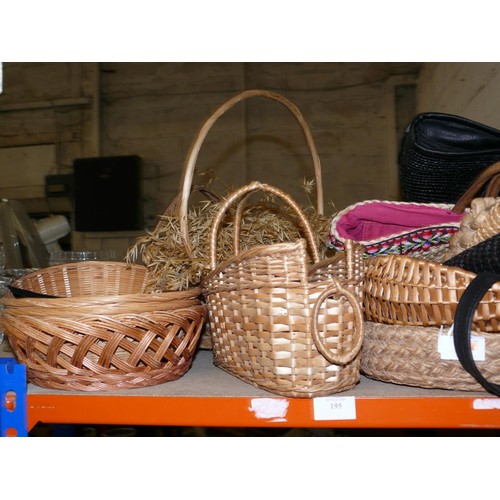 469 - A WHOLE SHELF OF WICKER BASKETS AND VARIOUS BAGS.