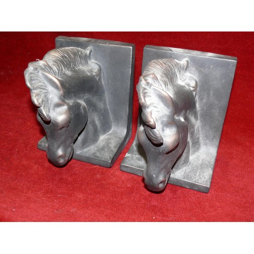 61 - PAIR OF POTTERY HORSE HEAD BOOKENDS, FINISHED IN BLACK, 6