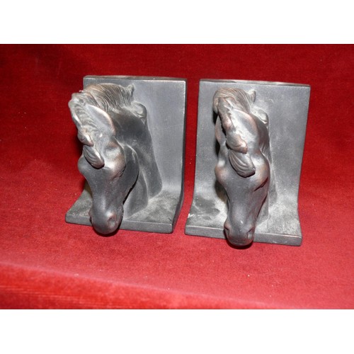 61 - PAIR OF POTTERY HORSE HEAD BOOKENDS, FINISHED IN BLACK, 6